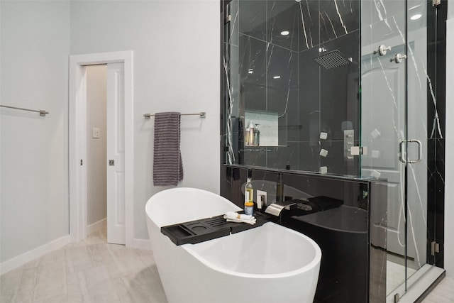 1302 Kelly Green Ct, Keller, TX 76248 - bathroom with a shower stall, a soaking tub, baseboards, and a sink