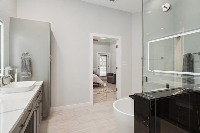 1302 Kelly Green Ct, Keller, TX 76248 - ensuite bathroom with vanity, a shower stall, a freestanding bath, and baseboards