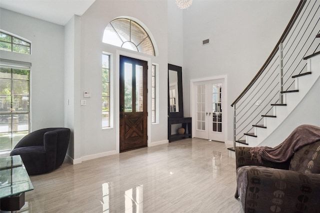 1302 Kelly Green Ct, Keller, TX 76248 - foyer entrance featuring french doors, baseboards, stairway, and a high ceiling