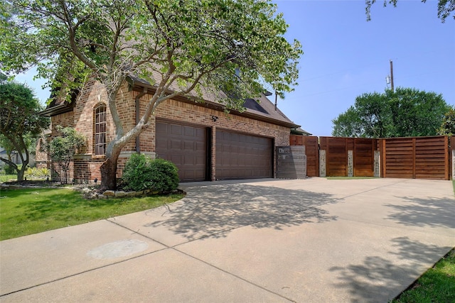 1302 Kelly Green Ct, Keller, TX 76248 - view of home's exterior featuring brick siding, concrete driveway, and a garage