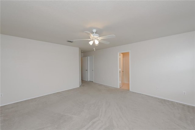 2913 Paddock Way, Denton, TX 76210 - spare room with light carpet and a ceiling fan