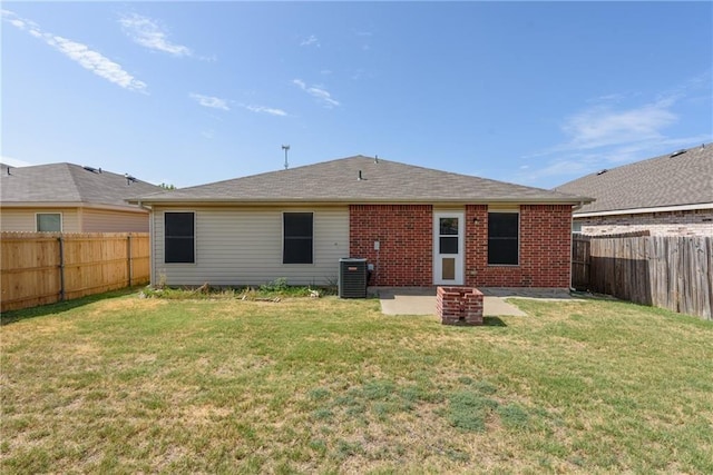 2913 Paddock Way, Denton, TX 76210 - rear view of house with brick siding and central air condition unit
