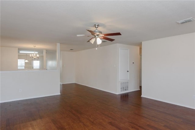 2913 Paddock Way, Denton, TX 76210 - empty room with a chandelier, ceiling fan, wood finished floors, and baseboards