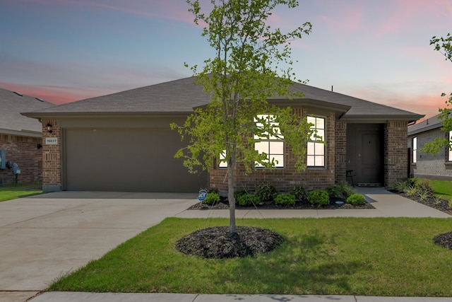 16637 Friesland Ln, Justin, TX 76247 - view of front facade with an attached garage, driveway, brick siding, and a front lawn