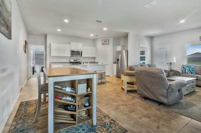 16637 Friesland Ln, Justin, TX 76247 - dining space with recessed lighting and light tile patterned floors