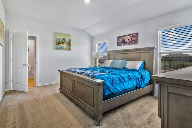 16637 Friesland Ln, Justin, TX 76247 - bedroom with light carpet, baseboards, lofted ceiling, and connected bathroom