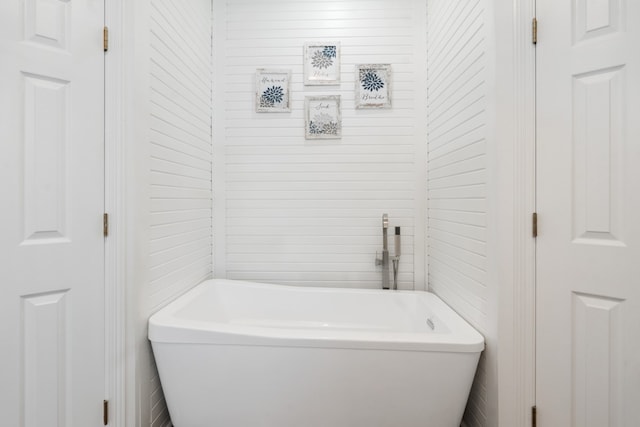 6881 Scenic Dr, Eustace, TX 75124 - bathroom with a freestanding bath and tile walls