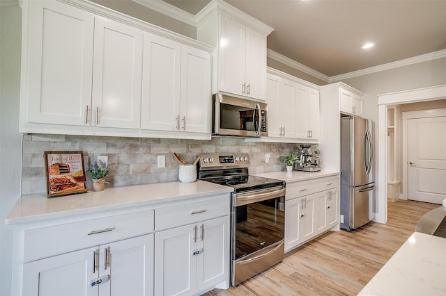 4017 Crick Ct, Weatherford, TX 76087 - kitchen with appliances with stainless steel finishes, crown molding, white cabinets, decorative backsplash, and light countertops
