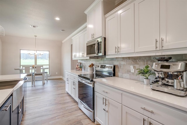 4017 Crick Ct, Weatherford, TX 76087 - kitchen featuring stainless steel appliances, baseboards, backsplash, light countertops, and white cabinets