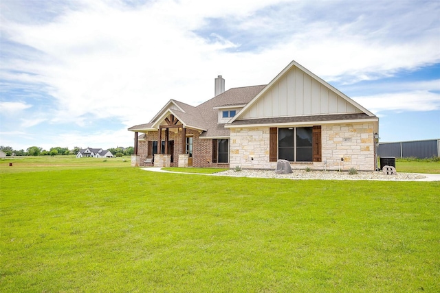 4017 Crick Ct, Weatherford, TX 76087 - view of front of house featuring board and batten siding, a shingled roof, a chimney, stone siding, and a front yard