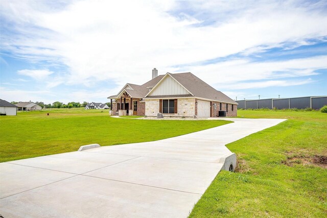 4017 Crick Ct, Weatherford, TX 76087 - foyer featuring a barn door, crown molding, baseboards, and a textured wall