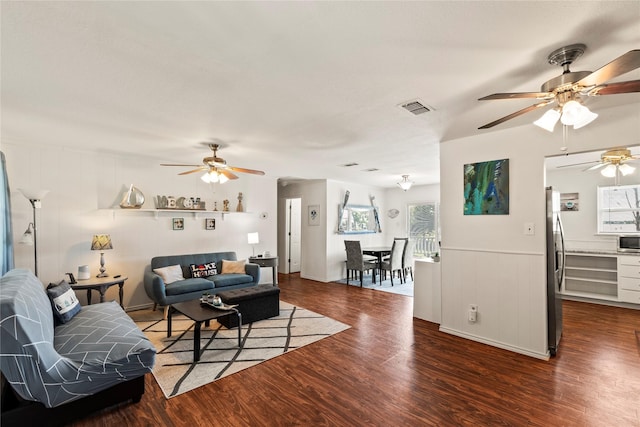 400 Causeway Vw, Seven Points, TX 75143 - living area featuring ceiling fan, wood finished floors, plenty of natural light, and wainscoting