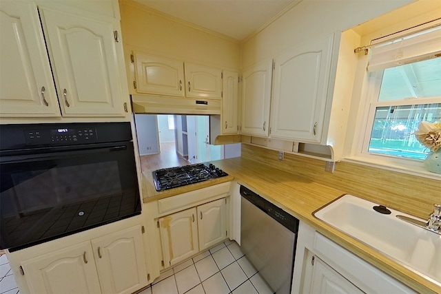 1602 England Rd, Arlington, TX 76013 - kitchen featuring black appliances, a sink, ornamental molding, light tile patterned floors, and light countertops