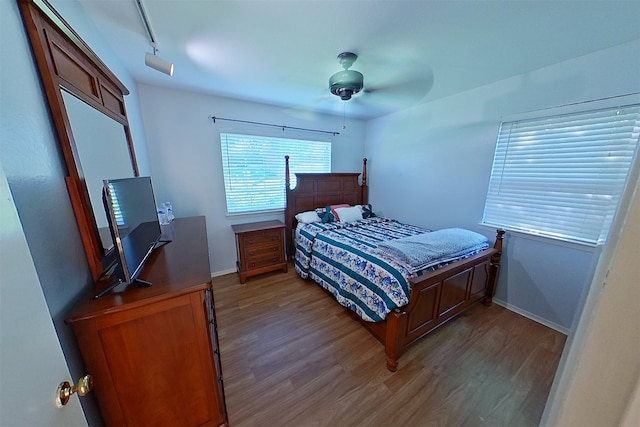 1602 England Rd, Arlington, TX 76013 - bedroom featuring wood finished floors, baseboards, and a ceiling fan