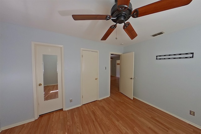 1602 England Rd, Arlington, TX 76013 - unfurnished bedroom featuring light wood-style flooring, baseboards, and a ceiling fan