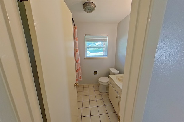 1602 England Rd, Arlington, TX 76013 - bathroom featuring toilet, vanity, tile patterned flooring, and a shower with curtain