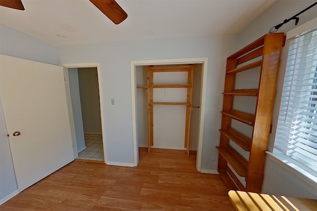 1602 England Rd, Arlington, TX 76013 - unfurnished bedroom with wood finished floors and a ceiling fan