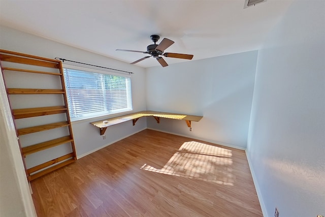 1602 England Rd, Arlington, TX 76013 - spare room with a ceiling fan, wood finished floors, and baseboards