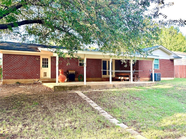 1602 England Rd, Arlington, TX 76013 - back of property featuring brick siding, a patio area, and central air condition unit