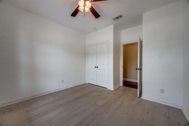 3331 Preston Club Dr, Sherman, TX 75092 - unfurnished bedroom featuring wood finished floors, baseboards, a closet, and a ceiling fan
