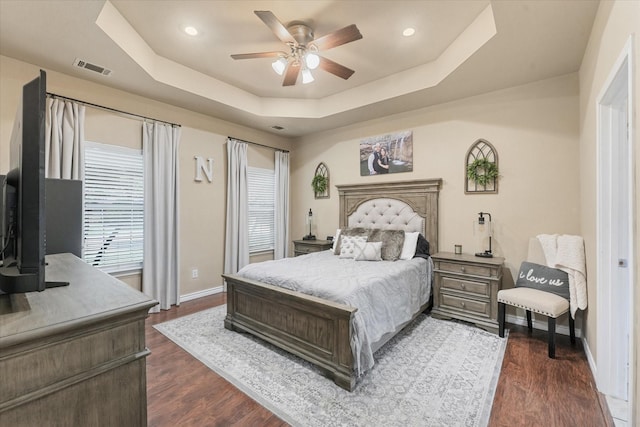 210 Sendero Dr, Waxahachie, TX 75165 - bedroom featuring a raised ceiling, baseboards, dark wood-style floors, ceiling fan, and recessed lighting