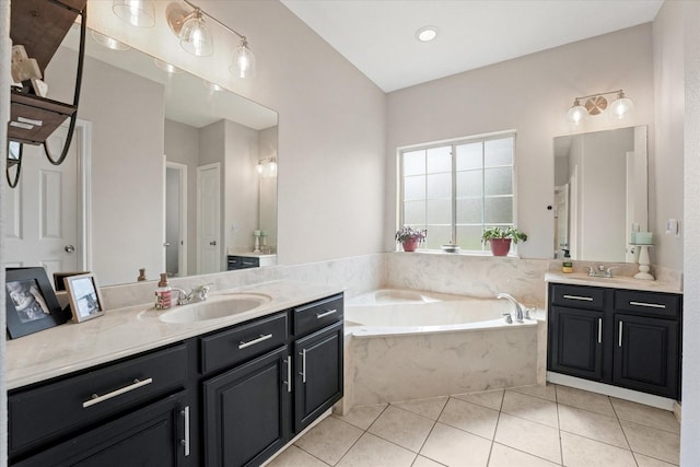 210 Sendero Dr, Waxahachie, TX 75165 - bathroom with two vanities, tile patterned floors, and a bath