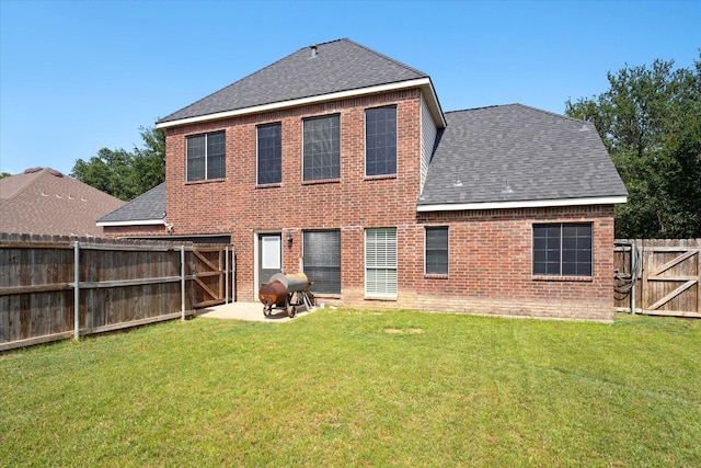 210 Sendero Dr, Waxahachie, TX 75165 - back of house with a shingled roof, a patio, a gate, and brick siding