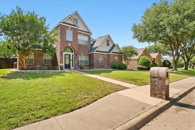 210 Sendero Dr, Waxahachie, TX 75165 - traditional-style house featuring brick siding
