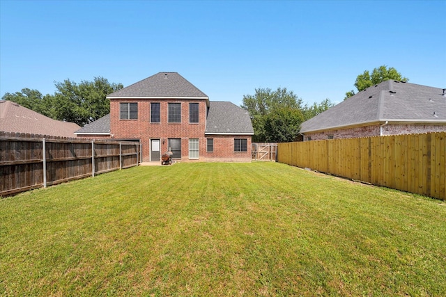 210 Sendero Dr, Waxahachie, TX 75165 - rear view of property featuring brick siding and a gate