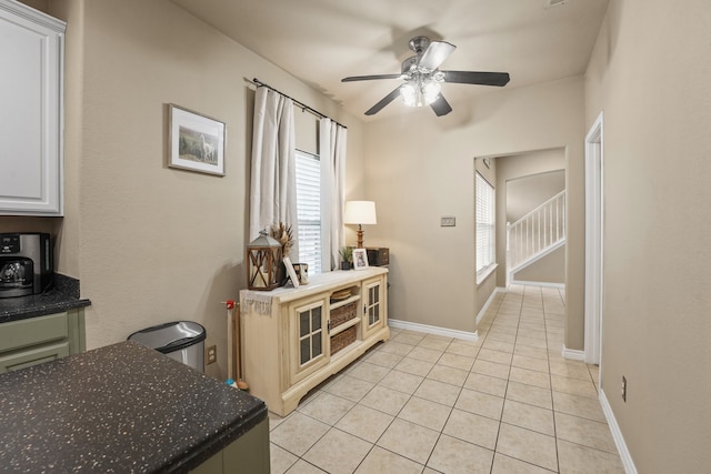 210 Sendero Dr, Waxahachie, TX 75165 - dining area with a ceiling fan, light tile patterned floors, and baseboards