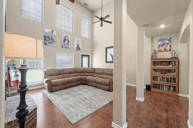 210 Sendero Dr, Waxahachie, TX 75165 - living area with a ceiling fan, baseboards, wood finished floors, and a towering ceiling