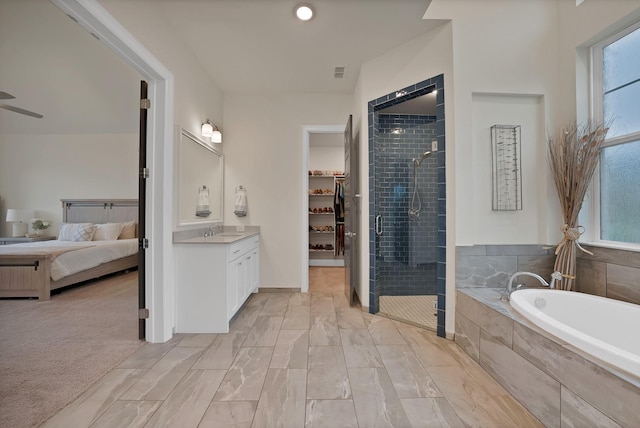 1306 Blue Lake Blvd, Arlington, TX 76005 - full bathroom featuring vanity, a shower stall, a bath, ensuite bath, and ceiling fan