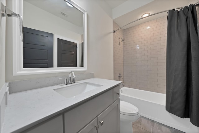 1306 Blue Lake Blvd, Arlington, TX 76005 - bathroom featuring vanity, toilet, and shower / bathtub combination with curtain