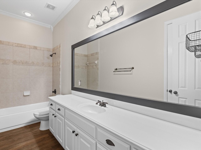 1105 Crown Valley Dr, Weatherford, TX 76087 - bathroom featuring ornamental molding, vanity, toilet, washtub / shower combination, and wood finished floors