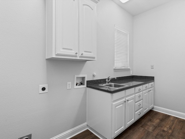 1105 Crown Valley Dr, Weatherford, TX 76087 - washroom with electric dryer hookup, washer hookup, baseboards, cabinet space, and dark wood-style floors