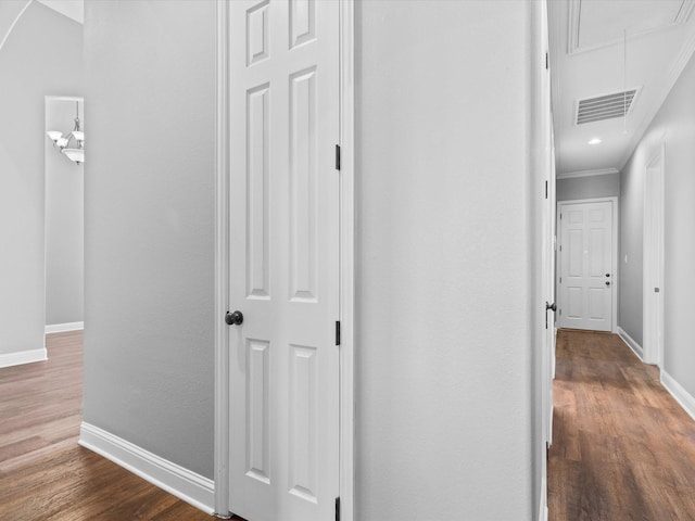 1105 Crown Valley Dr, Weatherford, TX 76087 - corridor with attic access, baseboards, dark wood finished floors, and ornamental molding