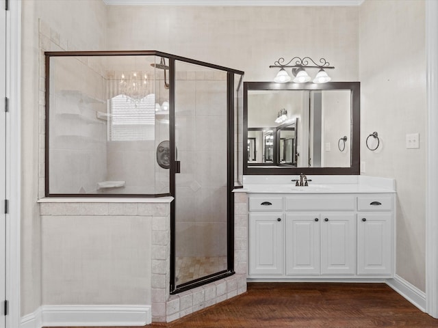 1105 Crown Valley Dr, Weatherford, TX 76087 - bathroom with vanity, wood finished floors, a stall shower, and baseboards