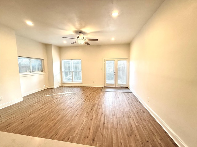 2807 Throckmorton St Unit 101, Dallas, TX 75219 - unfurnished room with french doors, wood finished floors, ceiling fan, recessed lighting, and baseboards