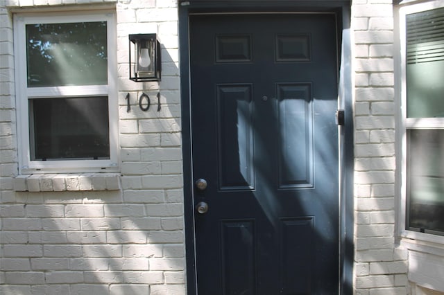 2807 Throckmorton St Unit 101, Dallas, TX 75219 - view of exterior entry featuring brick siding