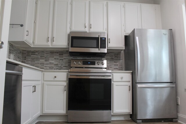 2807 Throckmorton St Unit 101, Dallas, TX 75219 - kitchen with stainless steel appliances and white cabinets
