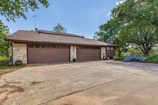 13220 Briar Rd, Azle, TX 76020 - view of front of home with stone siding, driveway, and an attached garage