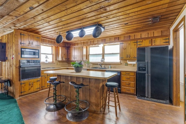 13220 Briar Rd, Azle, TX 76020 - kitchen featuring black appliances, wooden ceiling, light countertops, a sink, and brown cabinetry