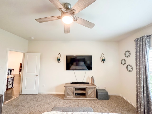 3225 Conley Ct, Mesquite, TX 75126 - carpeted living area featuring a ceiling fan and baseboards