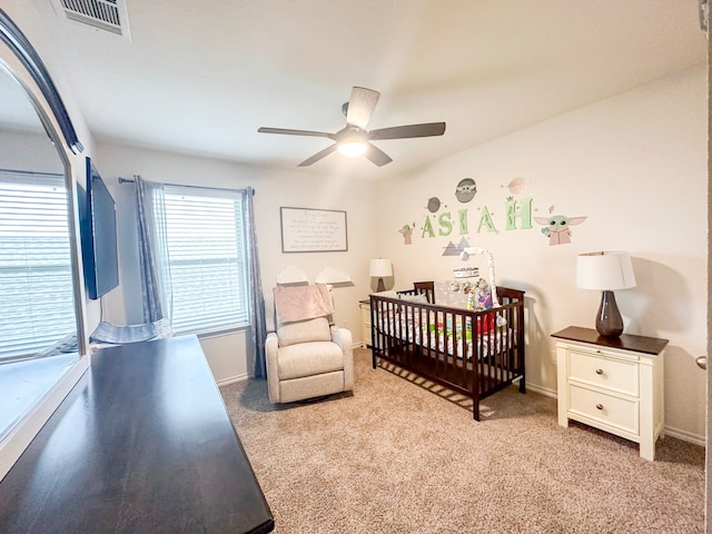 3225 Conley Ct, Mesquite, TX 75126 - bedroom featuring a nursery area, light carpet, baseboards, and ceiling fan