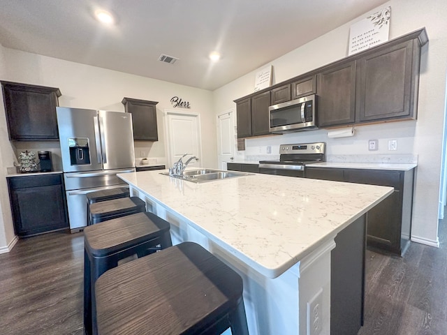 3225 Conley Ct, Mesquite, TX 75126 - kitchen featuring stainless steel appliances, a sink, dark wood-style floors, and dark brown cabinetry