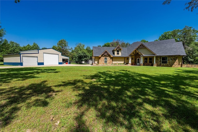 6296 Fm 1256, Mabank, TX 75147 - view of front of house with a garage, an outbuilding, stone siding, a front yard, and covered porch