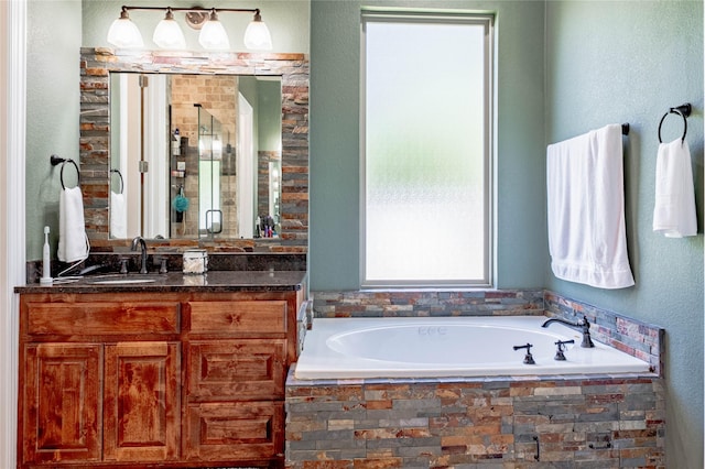 6296 Fm 1256, Mabank, TX 75147 - full bathroom with vanity, a garden tub, and a stall shower