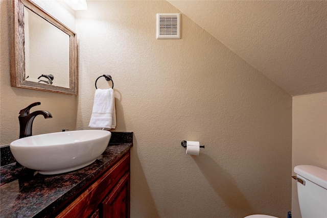 6296 Fm 1256, Mabank, TX 75147 - half bathroom with toilet, vanity, and vaulted ceiling