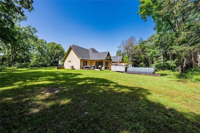 6296 Fm 1256, Mabank, TX 75147 - back of property featuring an outdoor pool and a yard