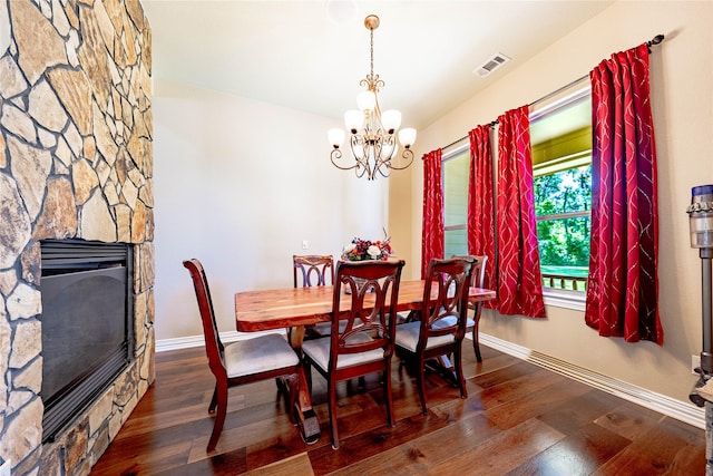 6296 Fm 1256, Mabank, TX 75147 - dining area featuring a chandelier, a fireplace, baseboards, and wood finished floors